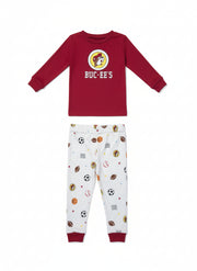 Buc-ee’s boy’s snug fit pajama set with red long-sleeve Buc-ee’s logo top and white sports-print pants featuring footballs, basketballs, soccer balls, and “82” accents, displayed on a clean white background.