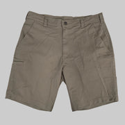 A front view of the Buc-ee's Caribou Fishing Twill Shorts in deep earth-brown taupe, shown laid flat against a neutral grey background. The image features a classic button-waist closure with a zipper fly, deep front slash pockets, and reinforced belt loops. On the right leg (viewer's left), a low-profile, horizontal-entry utility tool slot is visible, designed for quick access to gear. The heavy-duty cotton-twill fabric displays a rugged, matte texture suitable for outdoor use.