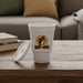 Buc-ee’s Cherry Cola scented candle in a white cup-style container featuring the Buc-ee’s beaver logo on the front, displayed on a wood coffee table.