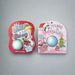 Two Buc-ee’s Christmas bath bombs — one in pink “Sugar Plum” packaging and one in red “Winter Berry” packaging — displayed on a carpet background.