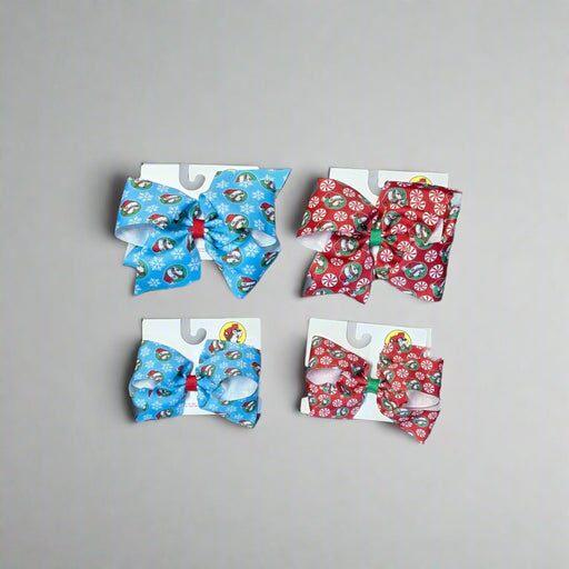 Set of Buc-ee’s Holiday Hair Bows in Snowflake (blue) and Peppermint (red) designs, shown in large and small sizes.