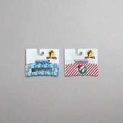Buc-ee’s Christmas Hair Claws in Snowflake (blue) and Peppermint (red) designs with holiday prints.