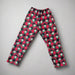 Full-length image of Buc-ee’s Christmas pajama pants displayed on a flat surface