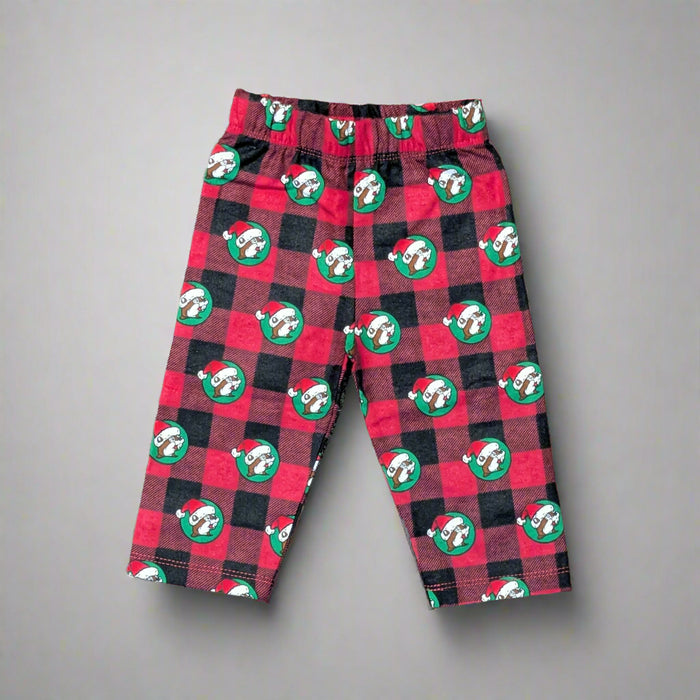 Front view of Infant Buc-ee's Christmas plaid pajama pants with red and green checkered pattern and beaver logo