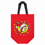 Bright red Buc-ee's reusable tote bag with black handles featuring Santa Buc-ee inside a yellow circle surrounded by colorful Christmas lights.