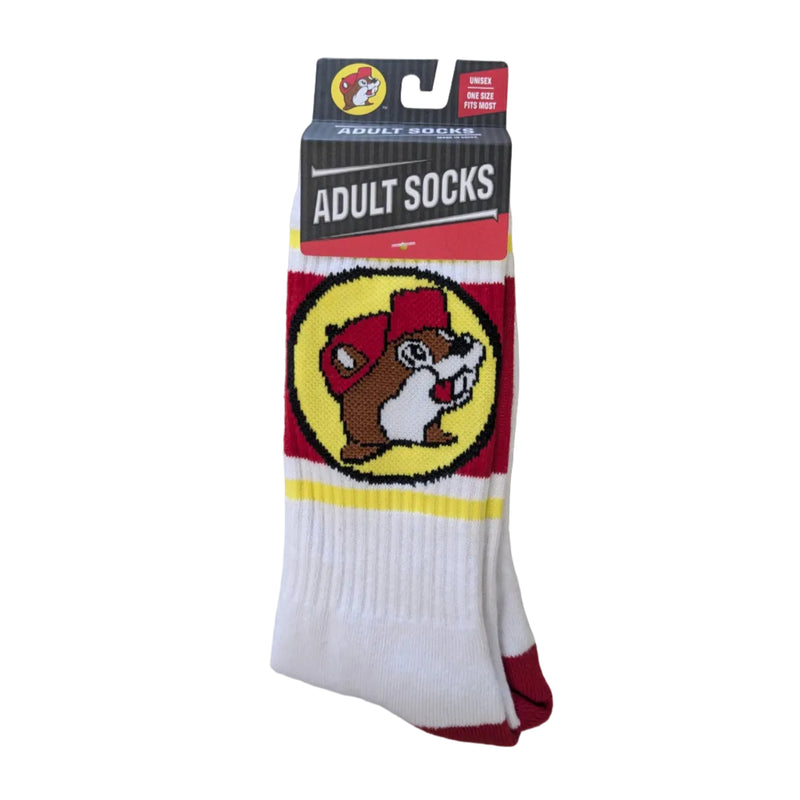 Pair of white Buc-ee's athletic crew socks with red and yellow athletic stripes, the classic Buc-ee beaver logo centered in a yellow circle, and red heel and toe accents.