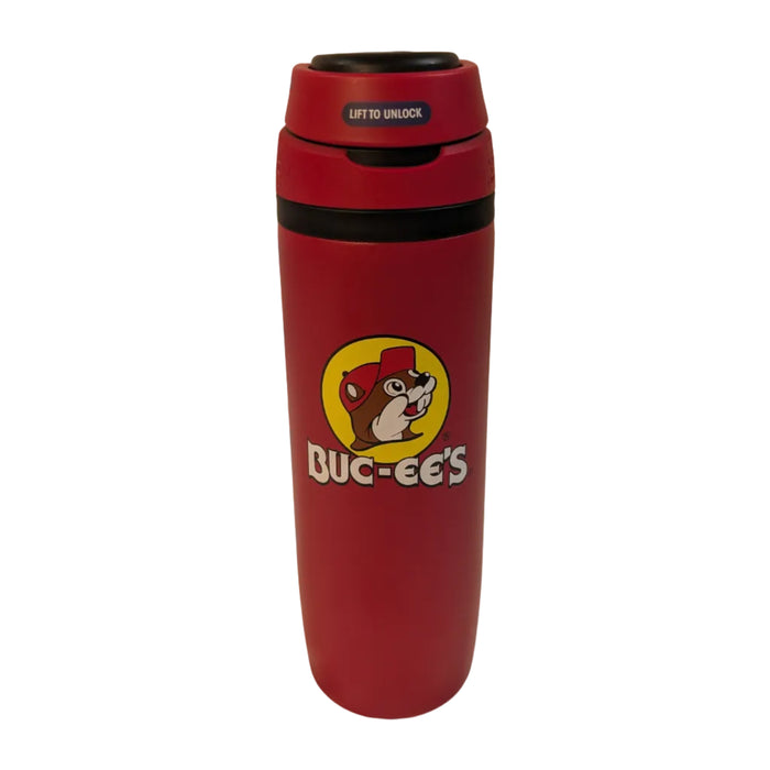 A front view of a Buc-ee'sClassic Red Hydrobubble Tumbler standing on a white surface. The front features the classic yellow circular Buc-ee's beaver logo. The top of the black and red locking lid is closed, displaying a blue sticker that reads "LIFT TO UNLOCK".