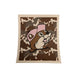 A square Swedish dishcloth featuring a brown and white cowhide pattern background. In the center is the Buc-ee's beaver mascot wearing a light pink baseball cap.