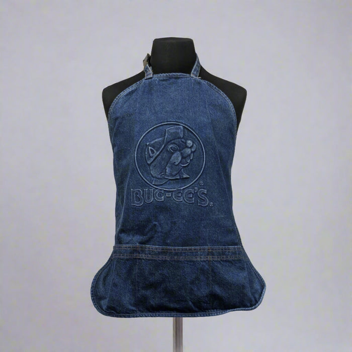 A denim blue Buc-ee's apron featuring an embossed logo with Bucky the Beaver, displayed on a mannequin.