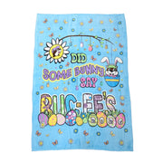 A large, rectangular light blue plush blanket laid flat. The center features the text "DID SOME BUNNY SAY BUC-EE'S" in colorful bubble letters. The design includes Buc-ee the beaver wearing bunny ears inside a blue egg, a daisy with Buc-ee's face in the center, and various decorated Easter eggs along the bottom, one of which displays the year "2026".