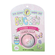 A Buc-ee's brand Cotton Candy bath bomb inside a clear plastic dome on a pink, spring-themed cardboard backing. The packaging features a cartoon Buc-ee beaver in an egg, butterflies, and the text 'DID SOME BUNNY SAY BUC-EE’S' and 'COTTON CANDY BATH BOMB'. Displayed on a clean white background.
