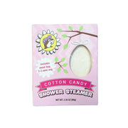 A square-shaped pink box for a Buc-ee's brand Cotton Candy shower steamer. The box features an egg-shaped window showing the product, an illustration of a cartoon Buc-ee beaver in a daisy, and text that reads 'Includes mesh bag, 2-3 uses avg' and 'COTTON CANDY SHOWER STEAMER'. Displayed on a clean white background.