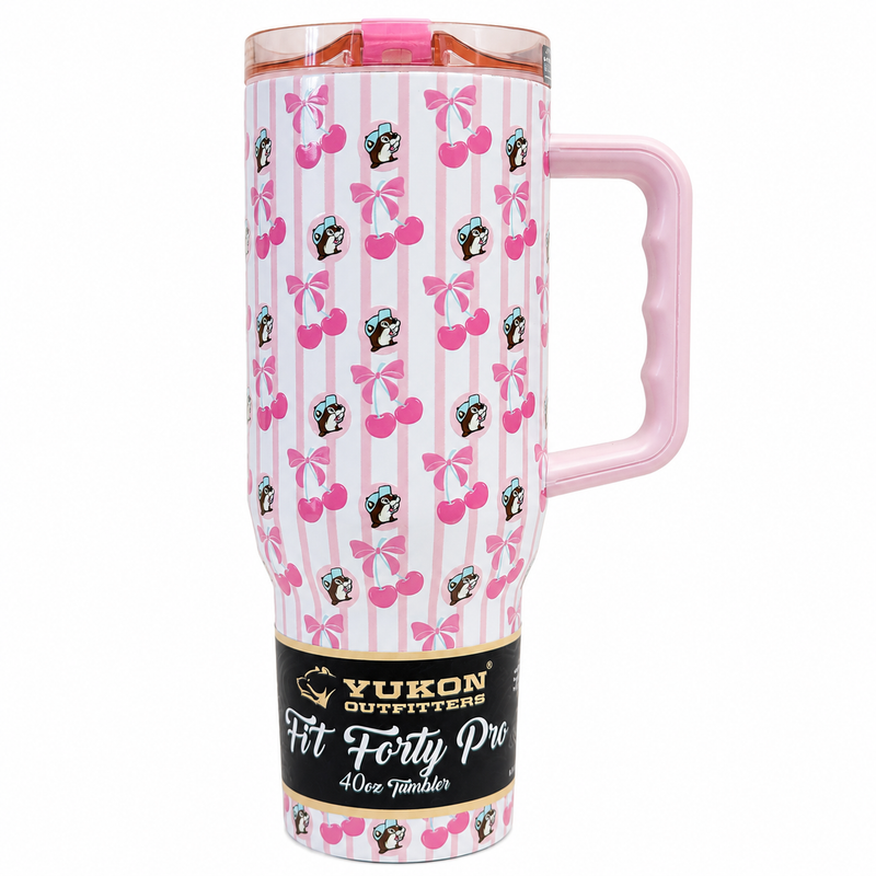 Front view of a 40oz Buc-ee's Fit Forty Pro stainless steel tumbler featuring a pink and white striped cherry and bow pattern with Buc-ee logos, a pink handle, and a cupholder base.
