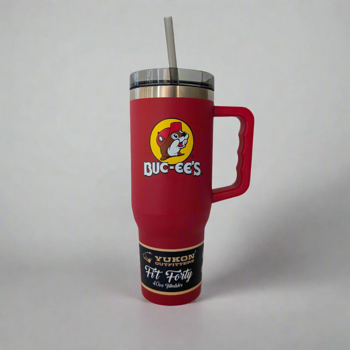 A red Buc-ee's Fit Forty 40oz tumbler with an ergonomic handle, spill-resistant lid, and a straw. It features the Buc-ee's logo and has a label reading 'Yukon' on the lower part.
