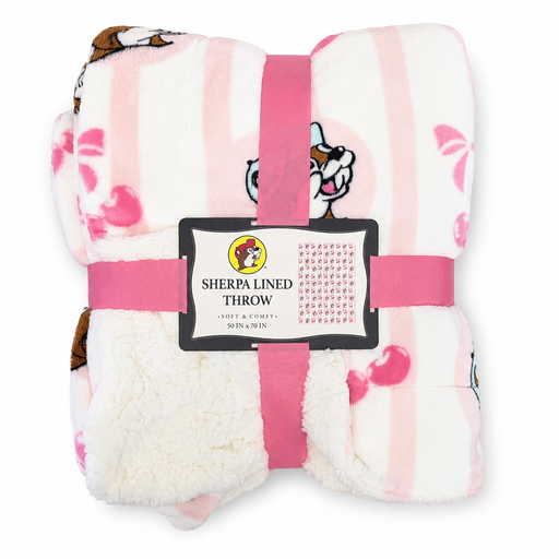 A folded Buc-ee’s Cherry Sherpa Lined Throw blanket tied neatly with a bright pink ribbon, displaying the official Buc-ee’s brand label reading "Sherpa Lined Throw - Soft & Comfy - 50 in x 70 in".