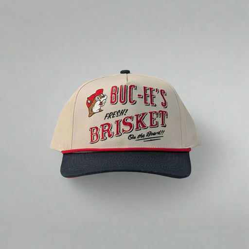 Front view of Buc-ee’s hat featuring embroidered "Fresh Brisket on the Board" text and Buc-ee the Beaver logo
