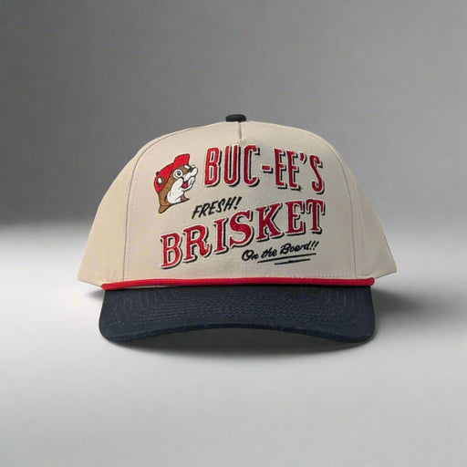 Front view of Buc-ee’s hat featuring embroidered "Fresh Brisket on the Board" text and Buc-ee the Beaver logo