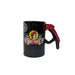 A black ceramic candle shaped like a gas pump handle with a red grip, featuring the Buc-ee's beaver logo and checkered flags on the front.