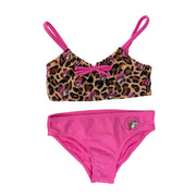 A girls' two-piece bikini set. The top features a leopard print pattern with pink Buc-ee's beaver icons and bright pink shoulder straps and pink bow in the middle of the chest. The matching bottoms feature a solid bright pink front with a small circular Buc-ee's mascot logo on the left hip, displayed on a clean white background.