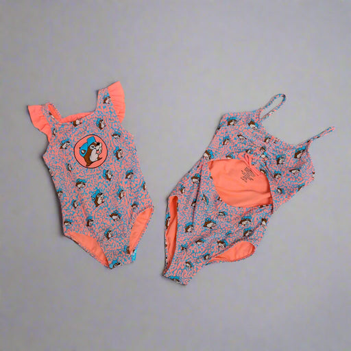 Buc-ee's Girls Pink and Blue Leopard Swim Suits. Youth has the stomach area showing and the toddler size is a one piece with a Buc-ee's logo. 