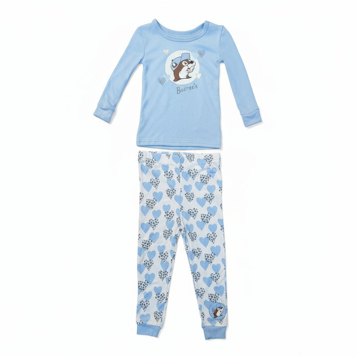 Bedtime just got a whole lot cuter. This Buc-ee’s Toddler Snow Leopard Pajama Set features a soft long-sleeve top paired with comfy matching pants — perfect for snuggly nights and lazy mornings. The top shows Buc-ee wearing a cozy winter hat surrounded by little hearts, while the pants bring the full blue-and-white snow leopard heart pattern to life.