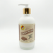 A square product shot of an 8 oz frosted glass pump bottle of Buc-ee's Glazed Pecans Hand & Body Lotion, featuring a gold neck collar and a white pump nozzle pointing to the left, isolated against a seamless, solid white background.