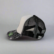 Side view showing black mesh back and adjustable snapback on Buc-ee’s hat