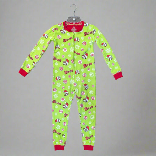 Buc-ee in a Santa hat, peppermint candy prints, snowflakes, and red cuffs on a bright green background.