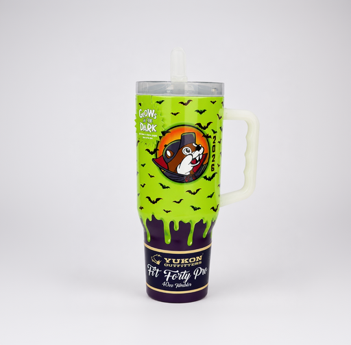 A 32 oz handled tumbler with a clear lid and straw, featuring a Halloween design. The upper half is bright lime green with black bats and a circular dog graphic, with the text 'GOWS DARK' and '2026'.