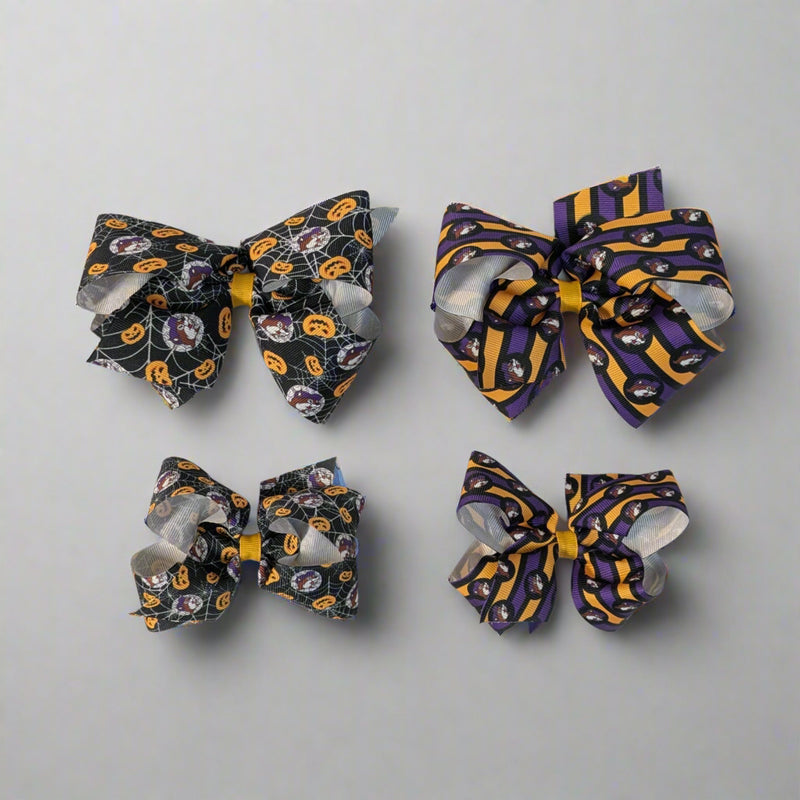 Buc-ee's Halloween Hair Bows. 2 different designs. Spiderweb and Jack-o-lantern and purple and orange stripes. 