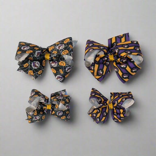 Buc-ee's Halloween Hair Bows. 2 different designs. Spiderweb and Jack-o-lantern and purple and orange stripes. 