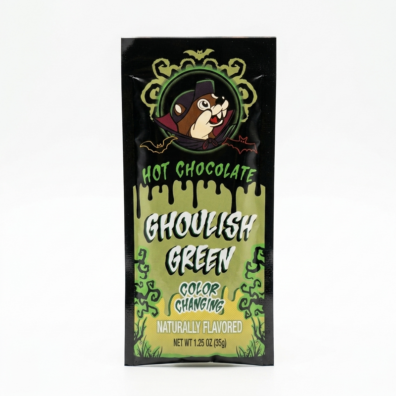 A single-serve Buc-ee's Halloween Ghoulish Green Color-Changing Hot Chocolate packet featuring Buc-ee the Beaver dressed as a vampire.