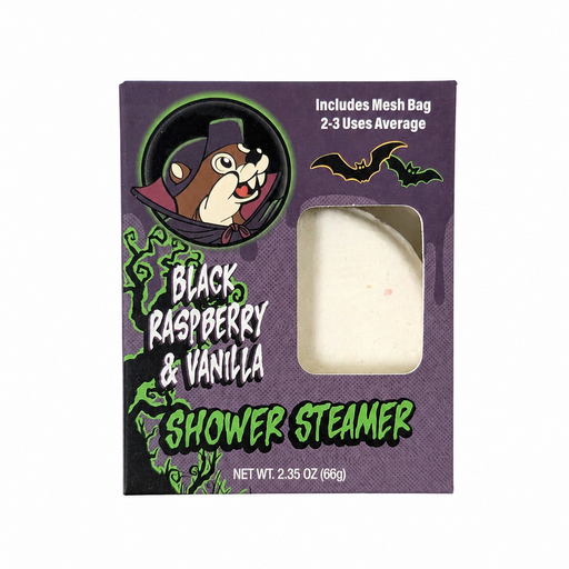 Buc-ee's Black Raspberry & Vanilla Halloween shower steamer in a purple box featuring vampire Buc-ee and a window showing the white steamer inside.