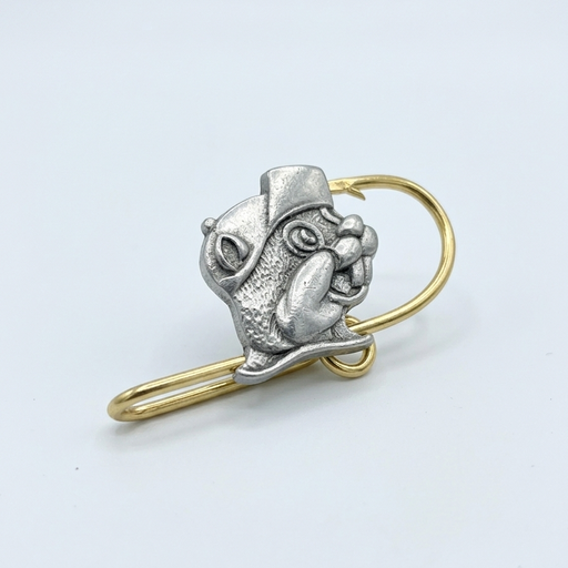 A high-detail product photograph of the Buc-ee's Handmade Hat Hook centered on a clean, solid white background. The accessory features a silver-tone, three-dimensional cast of the Buc-ee's Beaver mascot wearing a cap, mounted onto a polished gold-tone metal fishing hook. The hook is designed with a flat back to slide securely onto a hat brim, showing fine metallic textures and a premium two-tone finish.