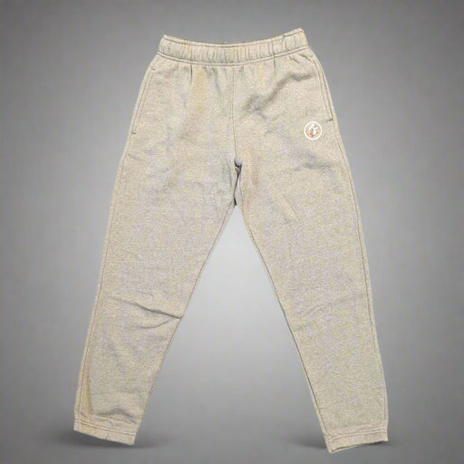 Flat lay of Buc-ee’s heather brown jogger pants with elastic waistband and ankle cuffs, featuring Buc-ee the Beaver patch on left leg