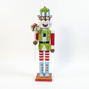 Buc-ee's Holiday Nutcracker - 2025 is holding a Lollipop and its a light green and blue with candies. 