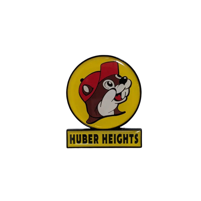 A high-gloss 2x2.5 inch souvenir magnet featuring the Buc-ee's logo—a beaver wearing a red hat inside a yellow circle with a black border. Below the circle is a yellow rectangular bar with the text "HUBER HEIGHTS" in bold black capital letters. The magnet is centered on a plain white background.