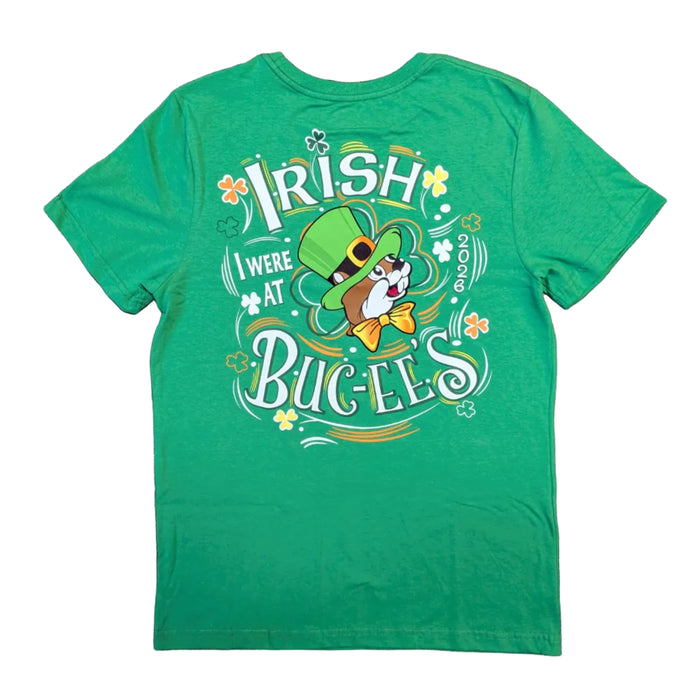 The back of a green t-shirt featuring the large text "IRISH I WERE AT BUC-EE'S" in a stylized white font. The year 2026 is printed vertically, and the center shows the Buc-ee's beaver in a leprechaun hat surrounded by orange and white shamrocks.