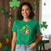 Woman wearing a green t-shirt with a cartoon dog design, standing in a room decorated for St. Patrick's Day.