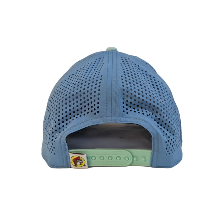 The back view of the light blue performance hat, showing the fully perforated mesh-style panels and a mint green adjustable plastic snapback strap. A small, square white tag featuring the classic yellow Buc-ee's logo is stitched next to the strap.