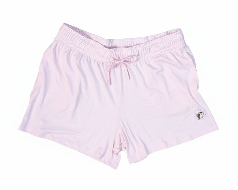 Light pink shorts with a small logo on a white background