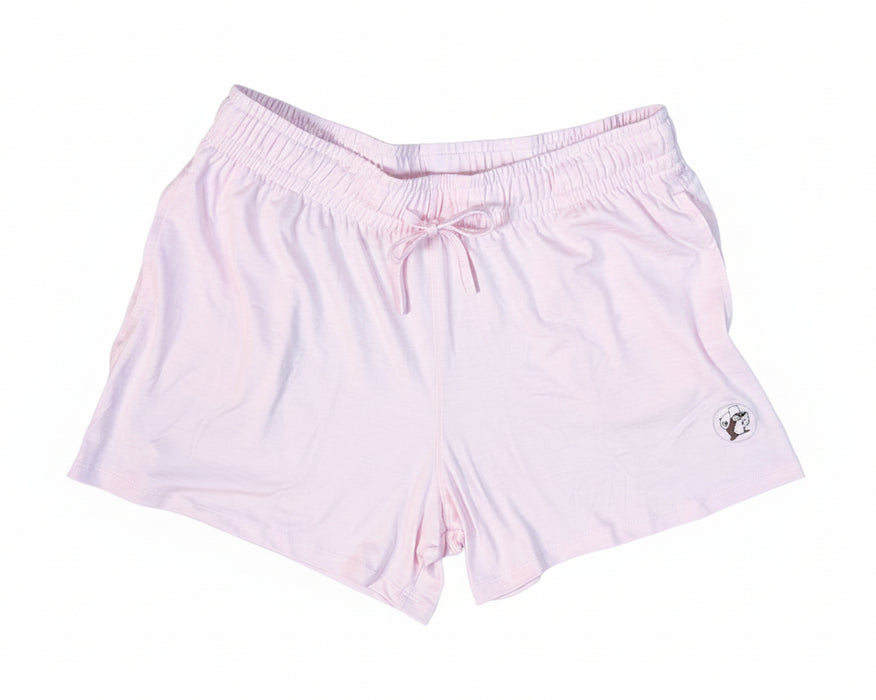 Light pink shorts with a small logo on a white background