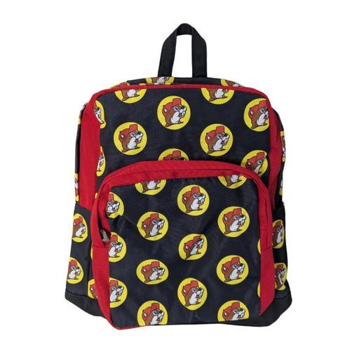 Front view of a 16-inch black canvas backpack featuring an all-over yellow-and-red Buc-ee's beaver logo pattern with red zipper trim and a top handle.