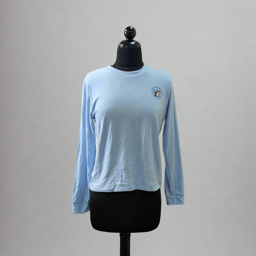 Buc-ee's Lounge Top is a light blue soft top with the logo on the upper left side.