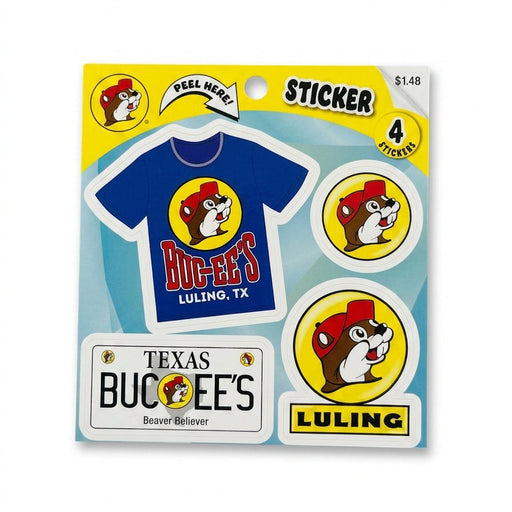 A 4-count Buc-ee's sticker sheet packaged on a yellow card. Stickers include a royal blue t-shirt graphic reading "Buc-ee's Luling, TX", a white Texas license plate sticker reading "Buc-ee's Beaver Believer", a circular Buc-ee's beaver logo sticker, and a yellow roadside billboard sign sticker reading "LULING".