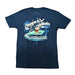 Back view of a navy blue Buc-ee's Margaritaville t-shirt laid flat on a white background, showcasing a large nautical circular graphic that reads "Changes in Latitudes, Changes in Attitudes" with Buc-ee the Beaver wearing a captain's hat on a fishing boat.
