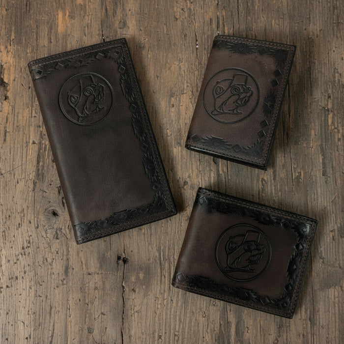 Three Buc-ee’s Men’s Genuine Leather Aztec Wallets in checkbook, bifold, and trifold styles, featuring dark brown leather with Aztec-tooled edges and stamped Buc-ee’s logo, displayed on a clean white background.