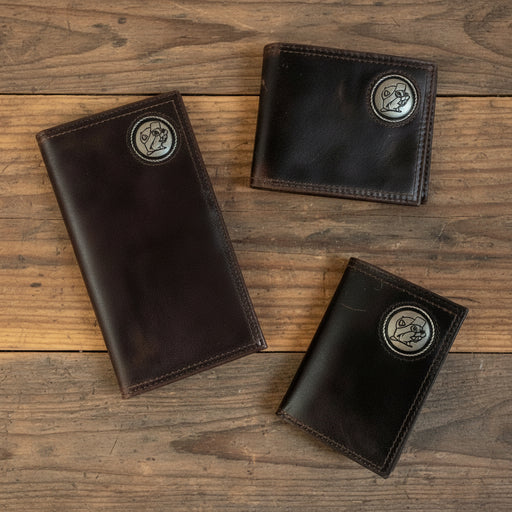 Three Buc-ee’s Men’s Genuine Leather Wallets in checkbook, bifold, and trifold styles, each featuring a metal Buc-ee’s concho emblem, displayed on a clean white background.
