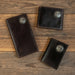 Three Buc-ee’s Men’s Genuine Leather Wallets in checkbook, bifold, and trifold styles, each featuring a metal Buc-ee’s concho emblem, displayed on a clean white background.