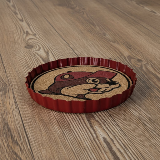 Buc-ee’s Beaver Metal Bottle Cap Coaster — featuring a cork center, bold red metal edge, and the famous Buc-ee’s beaver logo. Perfect for home bars and Buc-ee’s fans!